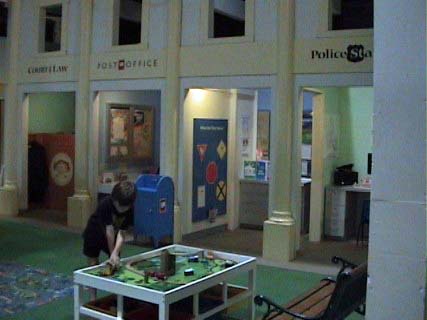 Child playing with train set